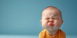 Displeased Baby Character Pouting with Pursed Lips Displaying Dissatisfaction and Irritation in Closeup Portrait with Copyspace