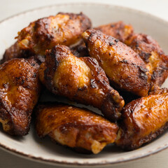 Wall Mural - Chicken wings marinated with spices in an American restaurant.