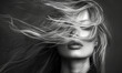 © piai - Blurry motion black and white photography of a blonde woman with hair covering her face