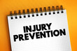 Injury Prevention text quote, concept on notepad