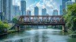 A commuter train crossing a steel truss bridge, transporting passengers across a bustling city river