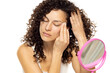 Skincare Concept. Attractive Curly Woman Removing Makeup Using Cotton Pad Cleansing Face Skin Over White Background.