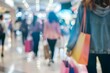 © Anastasiia - Blurred shoppers with bags in crowded mall during sale event. Concept Sale Event, Crowded Mall, Shoppers with Bags, Blurred Background, Shopping Rush