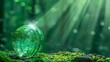   A green glass orb resting atop moss-covered ground, backdrop of shining beam
