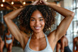 © ADDICTIVE STOCK - Radiant young woman with curly hair in gym setting. Generative AI image