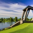 picturesque view of a rustic bascule bridge spanning over a tranquil river, flanked by meadows