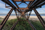 Fototapeta Łazienka - Historic steel bridge on the beach of the river Elbe.
