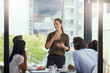 © peopleimages.com - Woman, leader and business meeting in office with collaboration, ideas or communication with employees. Female manager, teamwork or company with table for presentation, review of global sales