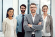 © peopleimages.com - Business people, portrait and team leadership in office or ceo with arms crossed, partnership or collaboration. Men, women and face at financial company for investment deal, accounting or corporate