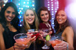 © peopleimages.com - Women, group and cocktail with toast for portrait at nightclub, event or happy hour together. People, club and drink with friends, alcohol and smile with celebration for new year with chat in night