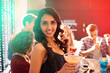 Portrait, woman and cocktail in party for celebration, birthday and event with friends. Disco lights, female person and alcohol for drinking in night club, concert and enjoying with techno music