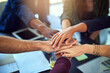 © peopleimages.com - Paperwork, meeting or business people with hands in stack for mission goal, collaboration or teamwork. Cooperation, community or top view of employees in office with support, solidarity or motivation