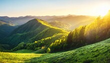 Wonderful Springtime Panoramic Landscape In Mountains At Sunset Grassy Slopes And Forested Hills Illuminated With Morning Sunshine
