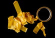 yellow repair tape roll isolated on black, clipping path