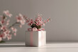 minimalist mother's day gift concept with pink flowers in white box on neutral background, with copy space for text