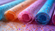 close-up of colorful wallpaper rolls with glitter accents for festive decoration