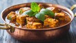 spicy paneer tikka masala in a copper pan generative ai