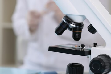 Wall Mural - quality control. food inspector working in laboratory, focus on microscope