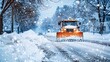 A snowplow or snow plow working to remove snow from a road after a winter storm. Winter road clearing