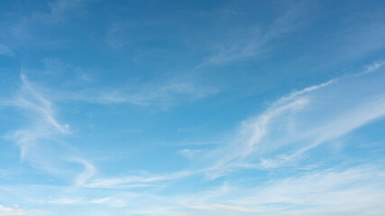 Wall Mural - white clouds against a blue sky on a sunny day.