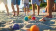 © Bijac - joyful people playing boules on sand with colorful balls summer holiday activity