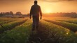 © Ps_Studio21 - Genuine moment of a farmer in the fields at sunrise, reflecting the true hard work and dedication in agriculture, perfect for stories on sustainable living.