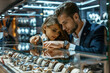Luxury shopping: affluent couple admiring upscale watches in exclusive jewelry boutique.