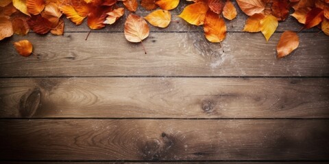 a group of orange leaves on a wood surface