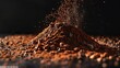The concluding pile of cocoa powder on a black background with 