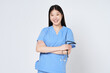 Smiling young asian woman doctor with stethoscope on white background.