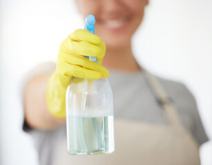 Poster - Person, hands and spray bottle with gloves for housekeeping, cleaning or domestic service at home. Closeup of maid or cleaner with chemical liquid for surface disinfection, hygiene or dirt removal