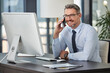 © peopleimages.com - Mature, business and man with phone call in office for corporate, communication and company client. Executive, technology and conversation in workplace for contract agreement, deal and good news