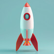A playful, stylized toy rocket with a retro design stands against a pale blue background, evoking nostalgia and adventure.
