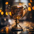 Golden trophy cup on a dark background with bokeh lights.
