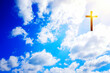 Cross in the blue sky with clouds. Christian symbol. Religion background.