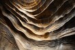 Lose yourself in the sinuous curves of a sandstone canyon, where ancient layers tell a tale of geological wonder. Marvel at the interplay of light and shadow, carving sculptural masterpieces in stone