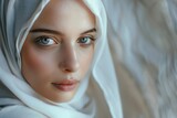 Fototapeta  - Portrait of beautiful young muslim arabian woman wearing white hijab looking at camera  copy space