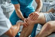 © sorin - Male physical therapist healing mans knee in rehabilitation clinic - physiotherapy concept