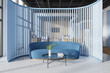 Stylish office interior with meeting place with blue sofa and coworking zone