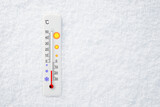 Fototapeta Natura - White celsius scale thermometer in snow. Ambient temperature minus 14 degrees celsius