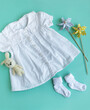 Baby dress for little girl, shoes, knitted toy and accessories.