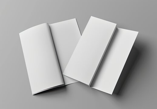 An open rectangle book with white paper pages rests on a gray table