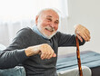 senior disabled man walking cane stick portrait health retirement elderly happy cheerful alone active grey hair