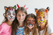 © Fabio - Children with animal face paintings isolated