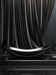 A black sink sits on a black table against a black background with black curtains.