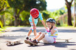 © famveldman - Kids with skate board. Skateboard fall and injury.
