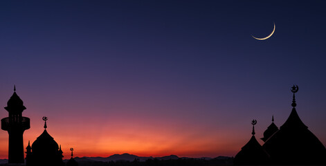 Sticker - Silhouette dome mosques and crescent moon on dusk sky twilight well space for text Eid Al Adha, Muharram