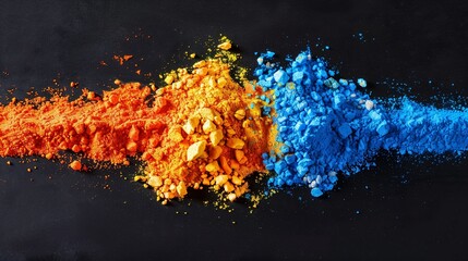 Wall Mural - An elevated view of blue, orange, and yellow holi powder design on a sleek black backdrop