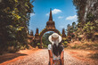 Traveler asian woman relax and travel in temple at Khao Na Nai Luang Dharma Park Surat Thani Thailand