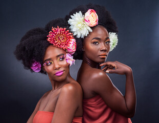 African, beauty and flowers in spring for makeup and art in dark background, studio and mockup. Floral, cosmetics and creative friends in portrait or black woman with natural and sustainable skincare